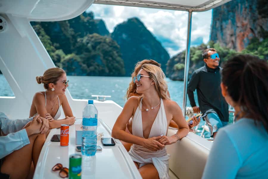 Phuket: James Bond & Phang Nga Bay by Luxury Sunset Yacht - Naka Island beach time: water slides and clear-kayak freedom
